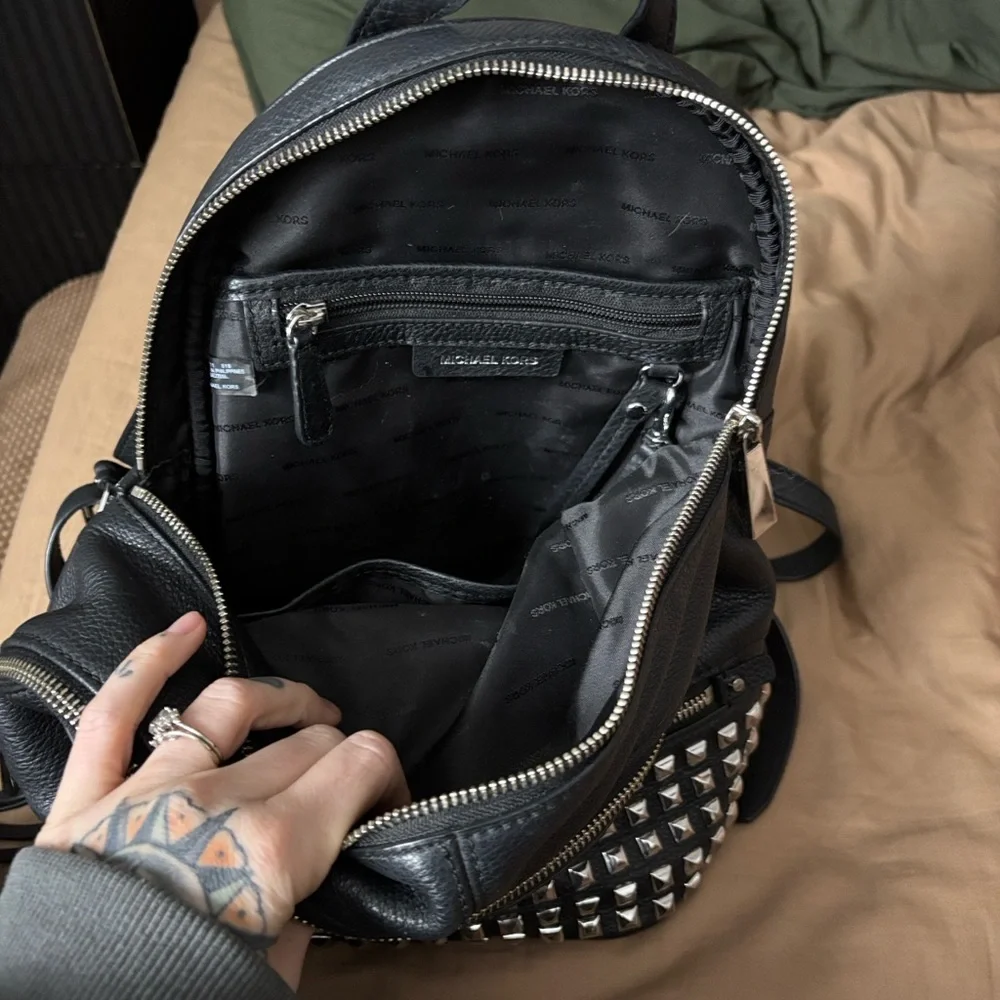 Michael Kors Black Leather Backpack with Silver Accents